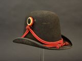 a black hat with a red cord around the brim and eyeball