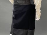 an image of a mannequin wearing a black skirt and a white shirt
