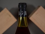 a bottle of wine that is sitting on a table