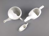 two cups and a spoon sitting on a table