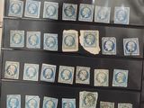 a lot of stamps that are on display on the wall