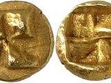 a close up of two gold coins with a cross on them