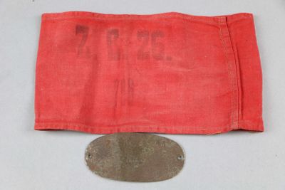 a close up of a coin and a red cloth on a table