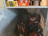 a metal cabinet filled with assorted items in a room