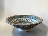 an image of a blue and white bowl sitting on top of a table