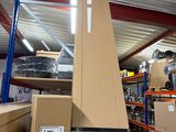a large cardboard tower in the middle of a warehouse