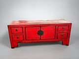 an image of a red table with drawers and drawers on top of it
