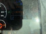 a close up of a car ' s dashboard with a speedometer