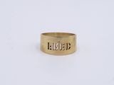 a gold ring with the word liked engraved on it
