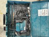 a blue box with tools inside of it on the floor