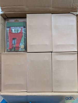 a cardboard box with a bunch of books inside of it