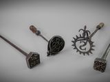 several different types of metal items are displayed on a white surface