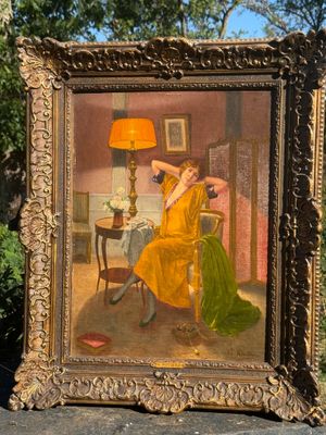 painting of a woman in a yellow dress sitting in a chair in front of a table with a lamp on it