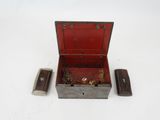 a small wooden box with a key inside of it