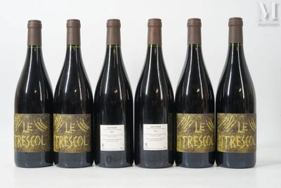 six bottles of wine are lined up in a row on a table