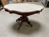 a table that has a marble top on it