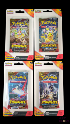 three packs of pokemon trading cards are shown in a package