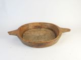 an old wooden bowl on a white surface with a white background