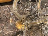 a glass candle holder on a marble counter top
