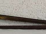 an old rusty pair of scissors on a white wall