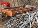 a large pile of wood sitting in the middle of the woods