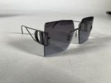 sunglasses on a white surface with a white background