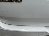 a close up of a white car with the name of the company on it