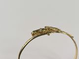 an image of a close up of a gold ring on a white background