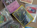 many different types of pokemon cards on the table