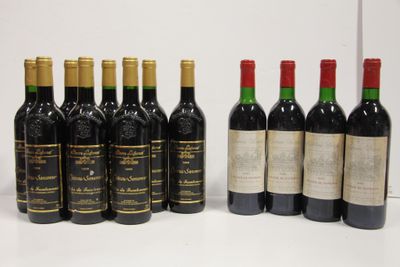 several bottles of wine are lined up on a white surface