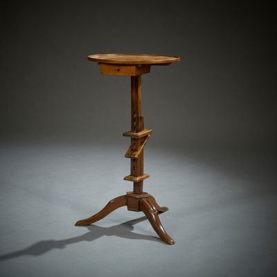 une image représentant une table en bois avec un plateau en bois sur fond gris
