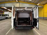 a white van with its doors open in a parking lot