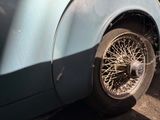 a close up of a car with a tire on it