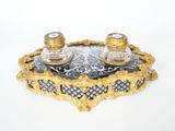 two salt and pepper shakers sitting on top of a tray