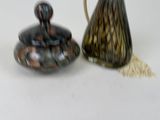 two vases sitting next to each other on a table