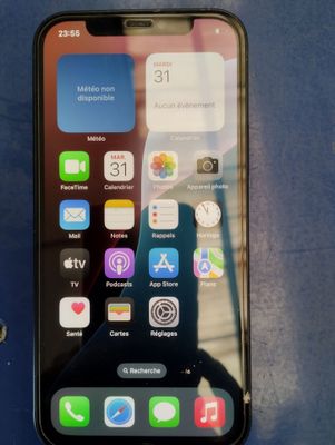 an iphone is sitting on top of a blue surface