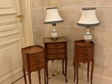 two lamps on the end tables in the corner of the room