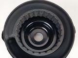 a close up of a black object on a white surface
