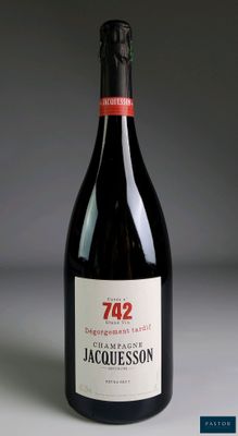 a bottle of wine that is sitting on a table