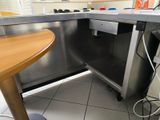 a kitchen with a sink and a table in it