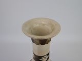 a white vase with a black and white design on it