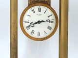 a wooden clock with roman numerals on the face