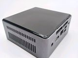 a small computer sitting on top of a white table