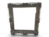 an old silver picture frame on a white background with a shadow