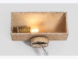 a close up of a light that is on a wall