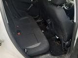 a white car with black seats in the back of it