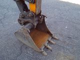 an image of a close up of a backhoe of a construction vehicle