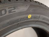 a close up of a tire with a yellow dot on the side of it