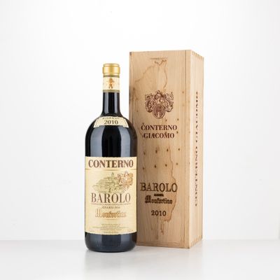a bottle of wine sitting next to a wooden box
