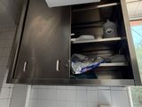 a kitchen with a sink and a window in it